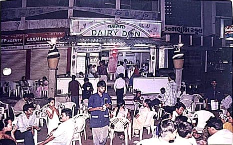 Dairy Don at night, with a crowd outside